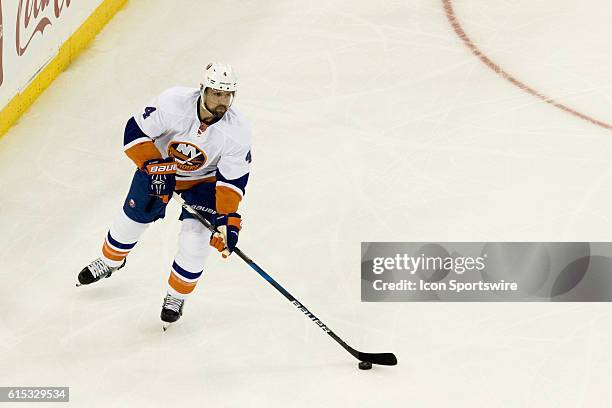 New York Islanders Denfenseman Dennis Seidenberg with the puck during the second period of opening night at Madison Square Garden in a NHL game...