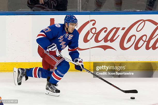 New York Rangers Defenseman Ryan McDonagh with the puck during the third period of opening night at Madison Square Garden in a NHL game between the...