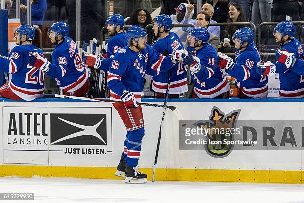 New York Rangers Defenseman Marc Staal works his way down the Rangers bench after scoring in the first period of a NHL game between the San Jose...