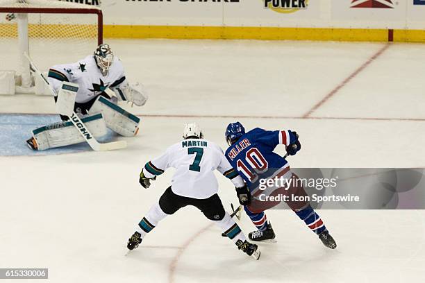 San Jose Sharks Defenseman Paul Martin leans on New York Rangers Center J.T. Miller to keep Miller from crossing in front of San Jose Sharks Goalie...