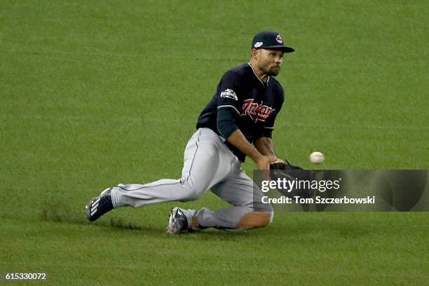 Coco Crisp of the Cleveland Indians catches a fly ball in left field hit by Josh Donaldson of the Toronto Blue Jays to end the seventh inning during...