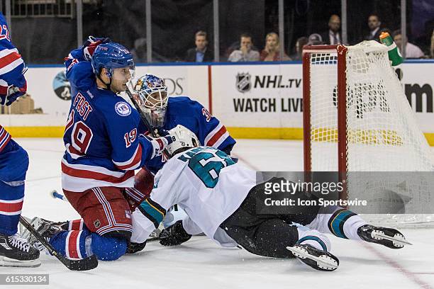 New York Rangers Right Wing Jesper Fast takes down San Jose Sharks Right Wing Melker Karlsson in front of the net during the third period of a NHL...