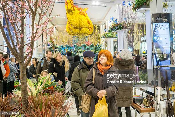 Macy's flagship department store in Herald Square in New York is festooned with floral arrangements for the 42nd annual Macy's Flower Show, on...