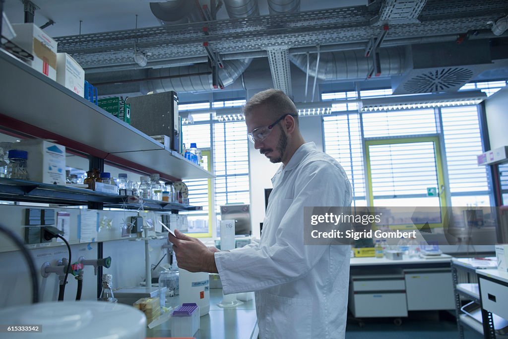 Male scientist working in a pharmacy laboratory, Freiburg im Breisgau, Baden-Württemberg, Germany