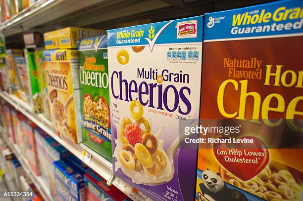 Boxes of General Mills Cheerios breakfast cereals in the grocery department of a store in New York on Wednesday, June 28, 2011. General Mills...