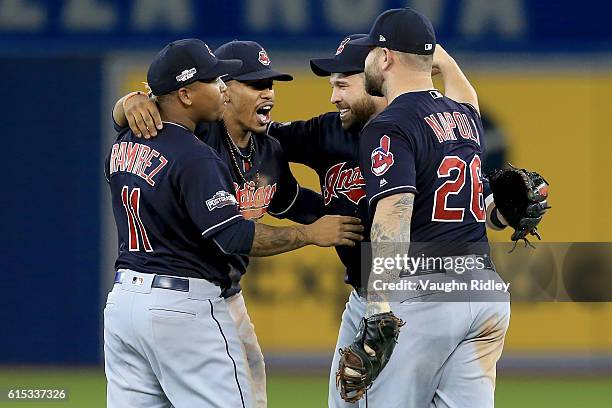 Jose Ramirez, Francisco Lindor, Jason Kipnis and Mike Napoli of the Cleveland Indians celebrate after defeating the Toronto Blue Jays with a score of...