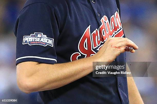 Detailed view of the bloody pinky finger of Trevor Bauer of the Cleveland Indians in the first inning against the Toronto Blue Jays during game three...