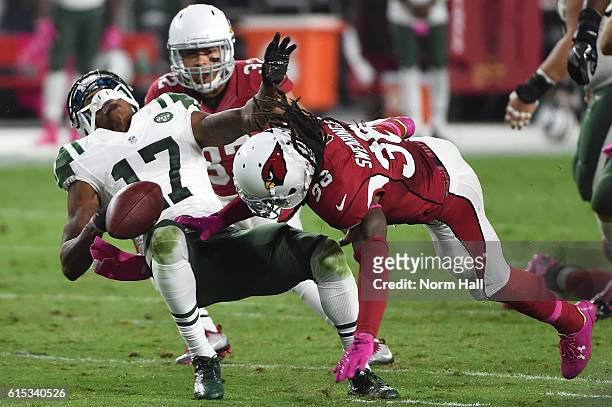 Wide receiver Charone Peake of the New York Jets is hit by defensive back D.J. Swearinger in the third quarter of the NFL game at University of...