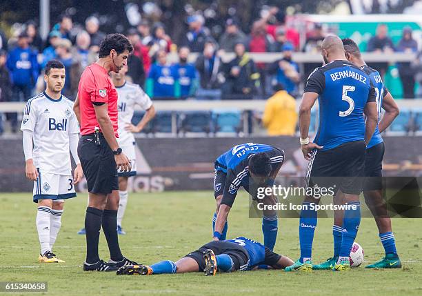 San Jose Earthquakes Defender/Midfielder Jordan Stewart is tended to by his teammates during the Major League Soccer game between the Vancouver...