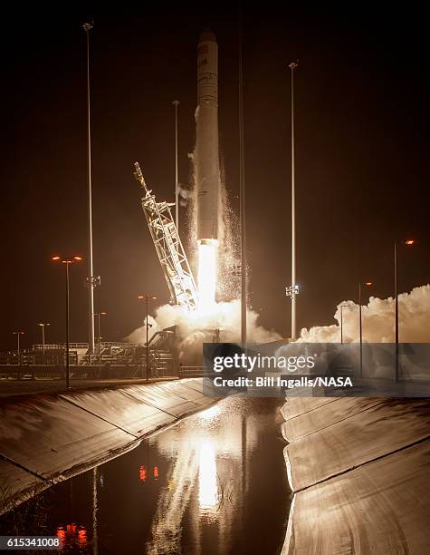 In this handout provided by NASA, the Orbital ATK Antares rocket, with the Cygnus spacecraft onboard, launches from Pad-0A at NASA's Wallops Flight...