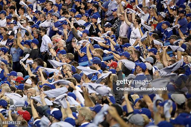 Toronto Blue Jays fans cheer during game three of the American League Championship Series against the Cleveland Indians at Rogers Centre on October...