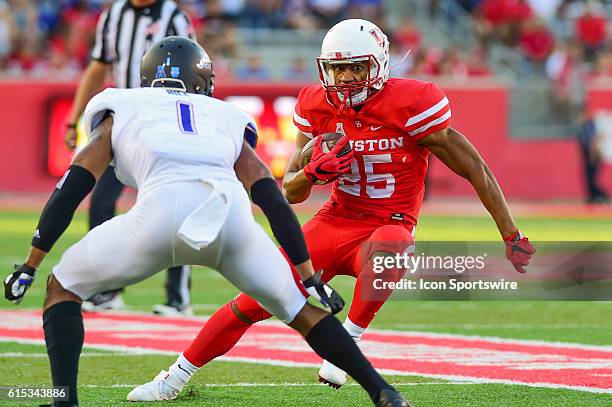 Houston Cougars running back Dillon Birden cuts back to the inside as Tulsa Golden Hurricane cornerback Keanu Hill defends during the Tulsa Golden...