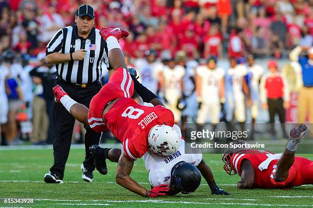 Houston Cougars linebacker Emeke Egbule and Tulsa Golden Hurricane running back D'Angelo Brewer are flipped as a result of a hard hit by Houston...