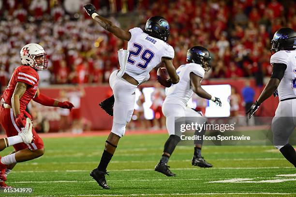 Tulsa Golden Hurricane wide receiver Justin Hobbs regains his balance after hurdling a player during the Tulsa Golden Hurricanes at Houston Cougars...