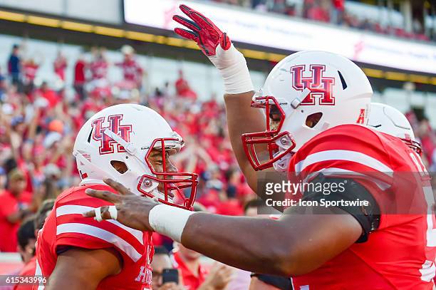 Houston Cougars offensive lineman Braylon Jones congratulates Houston Cougars running back Dillon Birden after his first half touchdown during the...