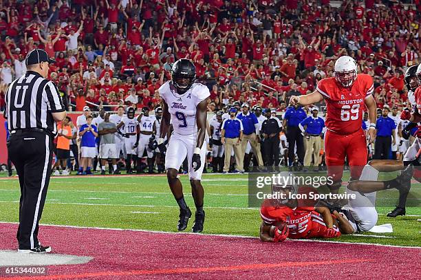 Houston Cougars running back Dillon Birden checks with the official to see if he's in the endzone during the Tulsa Golden Hurricanes at Houston...