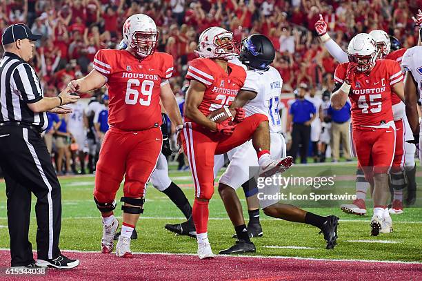 Houston Cougars running back Dillon Birden celebrates his rushing touchdown during the Tulsa Golden Hurricanes at Houston Cougars game at TDECU...