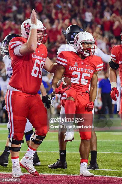 Houston Cougars running back Dillon Birden celebrates his rushing touchdown during the Tulsa Golden Hurricanes at Houston Cougars game at TDECU...