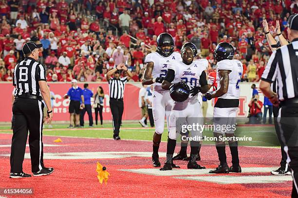 Tulsa Golden Hurricane running back James Flanders is flagged for unsportsmanlike conduct for taking his helmet off after his rushing touchdown...