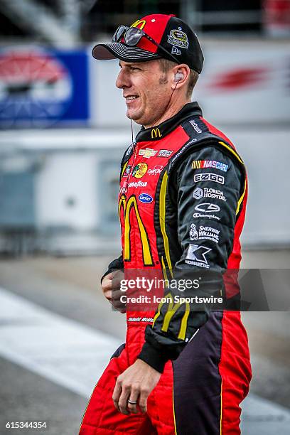 Sprint Cup Series driver Jamie McMurray walks along pit lane prior to qualifying for the NASCAR Sprint Cup Series Bad Boy Off Road 300 at New...