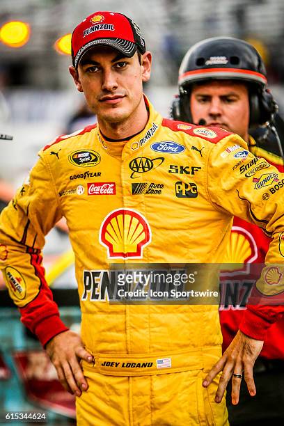 Sprint Cup Series driver Joey Logano looks on prior to qualifying for the NASCAR Sprint Cup Series Bad Boy Off Road 300 at New Hampshire Motor...