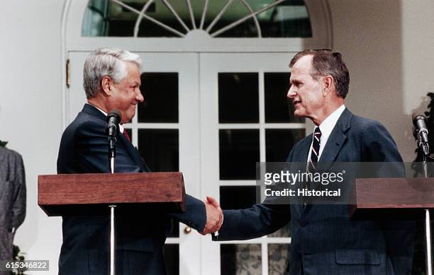 President George Bush and Boris Yeltsin shake hands at their first meeting, on June 2, 1991. After the collapse of the Soviet Union, Yeltsin became...