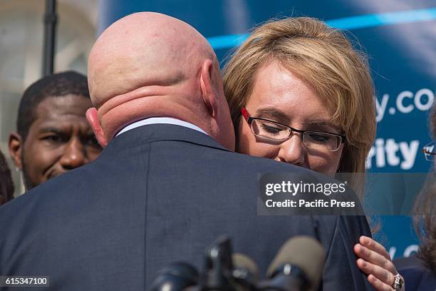 Mark Kelly embraces his wife Gabby Giffords at the rally. A rally for gun law reform was held on the steps of New York City's City Hall as part of a...