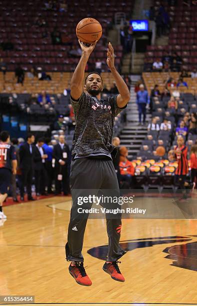 Norman Powell of the Toronto Raptors warms up prior to an NBA preseason game against San Lorenzo de Almagro at Air Canada Centre on October 14, 2016...