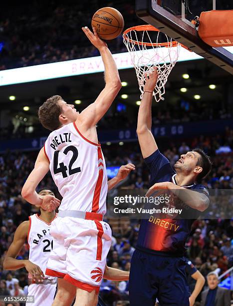 Jakob Poeltl of the Toronto Raptors shoots the ball during a NBA preseason game against San Lorenzo de Almagro at Air Canada Centre on October 14,...