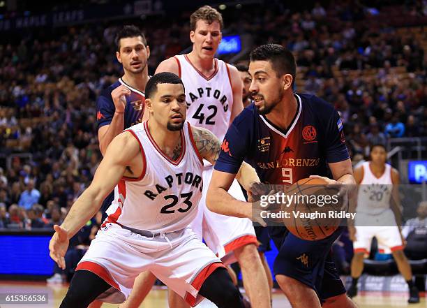 Santiago Scala of San Lorenzo de Almagro dribbles the ball as Fred VanVleet of the Toronto Raptors defends during a NBA preseason game at Air Canada...