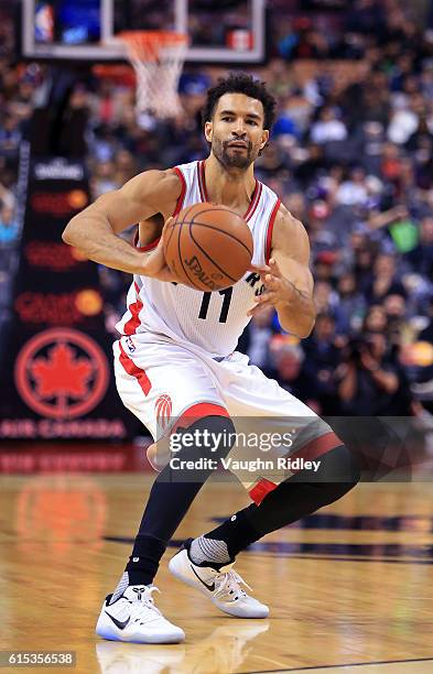 Drew Crawford of the Toronto Raptors passes the ball during a NBA preseason game against San Lorenzo de Almagro at Air Canada Centre on October 14,...