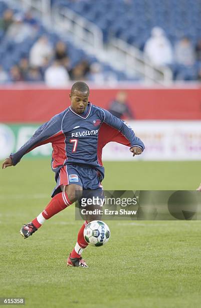 Forward Andy Williams of the New England Revolution passes the ball during the MLS match against the Chicago Fire at CMGI Field in Foxboro,...