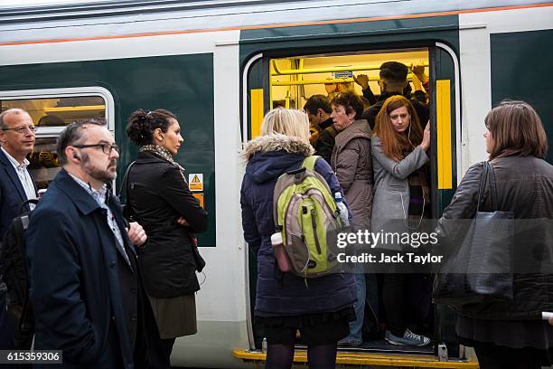 Commuters packed on to a Southern rail train wait to leave East Croydon station on October 18, 2016 in London, England. Staff at Southern rail have...