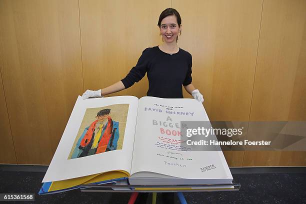 Marlene Taschen shows the 2000 Euro David Hockney sumo book, during the opening press conference of the 2016 Frankfurt Book Fair on October 18, 2016...