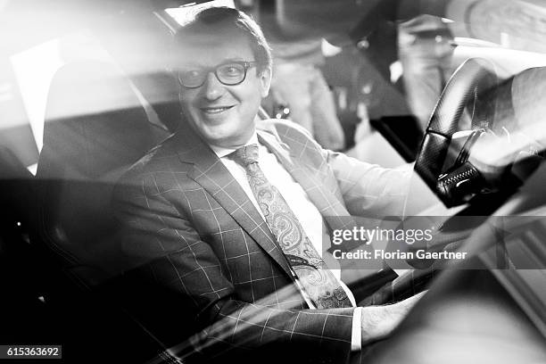 Image has been converted to black and white.) BERLIN, GERMANY German Transport Minister Alexander Dobrindt sits in an Audi RS7 on October 18, 2016 in...