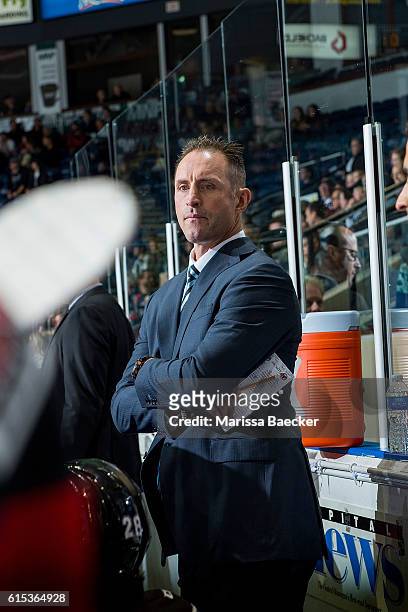 Former NHL player and head coach of the Kelowna Rockets, Jason Smith, stands on the bench against the Saskatoon Blades on October 14, 2016 at...