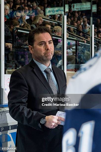 Head Coach, Dean Brockton, of the Saskatoon Blades stands on the bench against the Kelowna Rocketson October 14, 2016 at Prospera Place in Kelowna,...