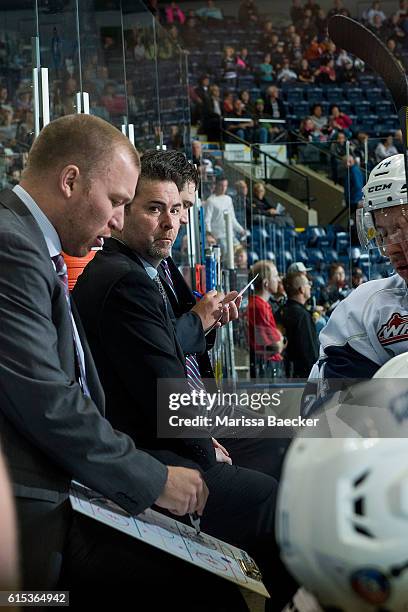 Head Coach, Dean Brockton, of the Saskatoon Blades stands on the bench against the Kelowna Rocketson October 14, 2016 at Prospera Place in Kelowna,...