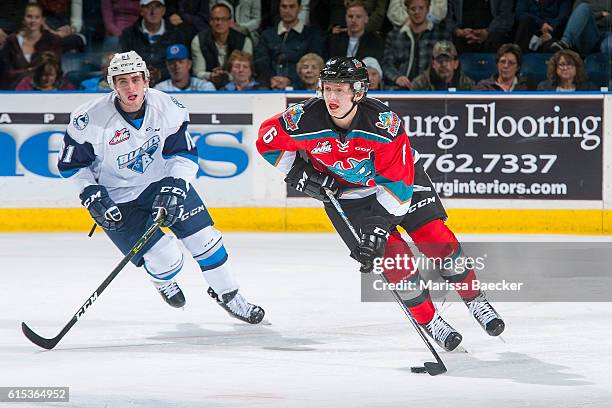 Josh Paterson of Saskatoon Blades skates after Jonathan Smart of Kelowna Rockets as he moves the puck up the ice on October 14, 2016 at Prospera...