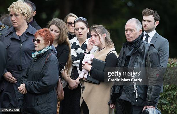 Mourners gather around the graveside for the funeral of a baby girl who was found dead on a footpath earlier this year at Wolvercote Cemetery on...