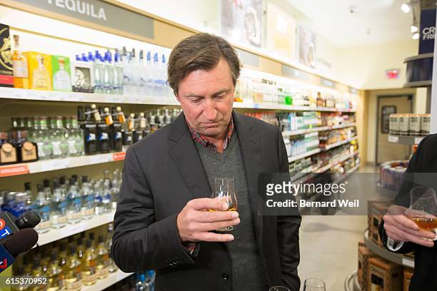 Wayne Gretzky sniffs a shot of his new No. 99 Canadian Whisky he launched at the Maple Leaf Square LCBO. O