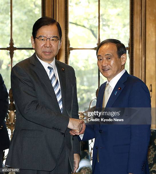 Japanese Communist Party leader Kazuo Shii meets with Chief Cabinet Secretary Yoshihide Suga in Tokyo on Oct. 18, 2016. Shii asked Suga that Japan...