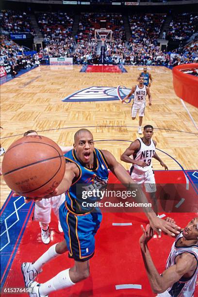 Jerome Williams of the Detroit Pistons shoots against the New Jersey Nets circa 1998 at the Contintental Airlines Arena in East Rutherford, New...