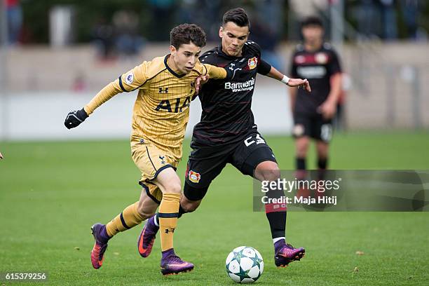 Atakan Akkakaynak of Leverkusen battles for the ball with Samuel Shashoua of Tottenham during the UEFA Youth Champions League match between Bayer...