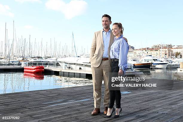 Actor Billy Campbell and Canadian actress Karine Vanasse pose during a photocall for the TV series "Cardinal" as part of the MIPCOM on October 18,...