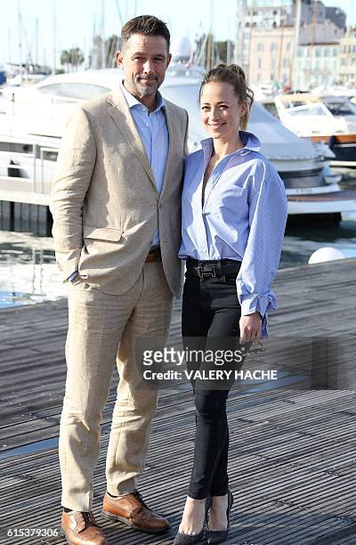 Actor Billy Campbell and Canadian actress Karine Vanasse pose during a photocall for the TV series "Cardinal" as part of the MIPCOM on October 18,...