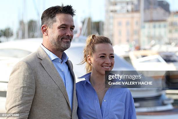 Actor Billy Campbell and Canadian actress Karine Vanasse pose during a photocall for the TV series "Cardinal" as part of the MIPCOM on October 18,...