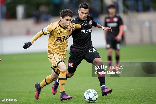 Atakan Akkakaynak of Leverkusen battles for the ball with Samuel Shashoua of Tottenham during the UEFA Youth Champions League match between Bayer...