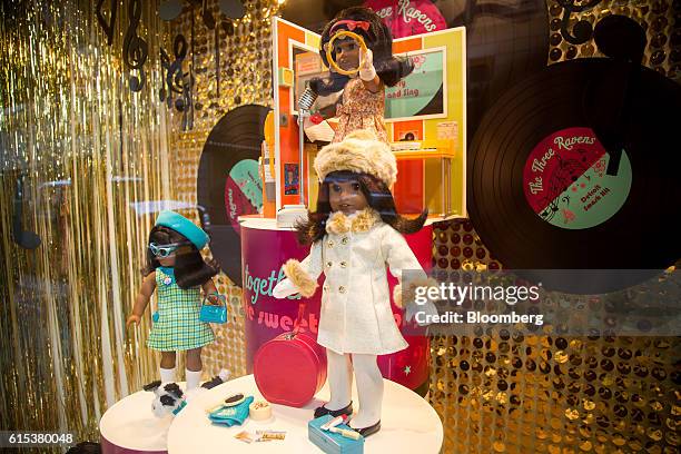 Melody Ellison Dolls are displayed in the window of an American Girl Place store on 5th Avenue in New York, U.S., on Monday, Oct. 17, 2016. Mattel...