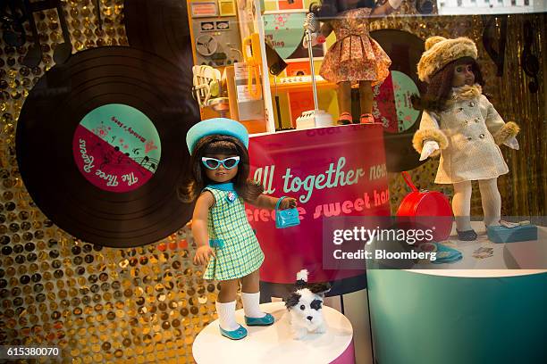 Melody Ellison Dolls are displayed in the window of an American Girl Place store on 5th Avenue in New York, U.S., on Monday, Oct. 17, 2016. Mattel...